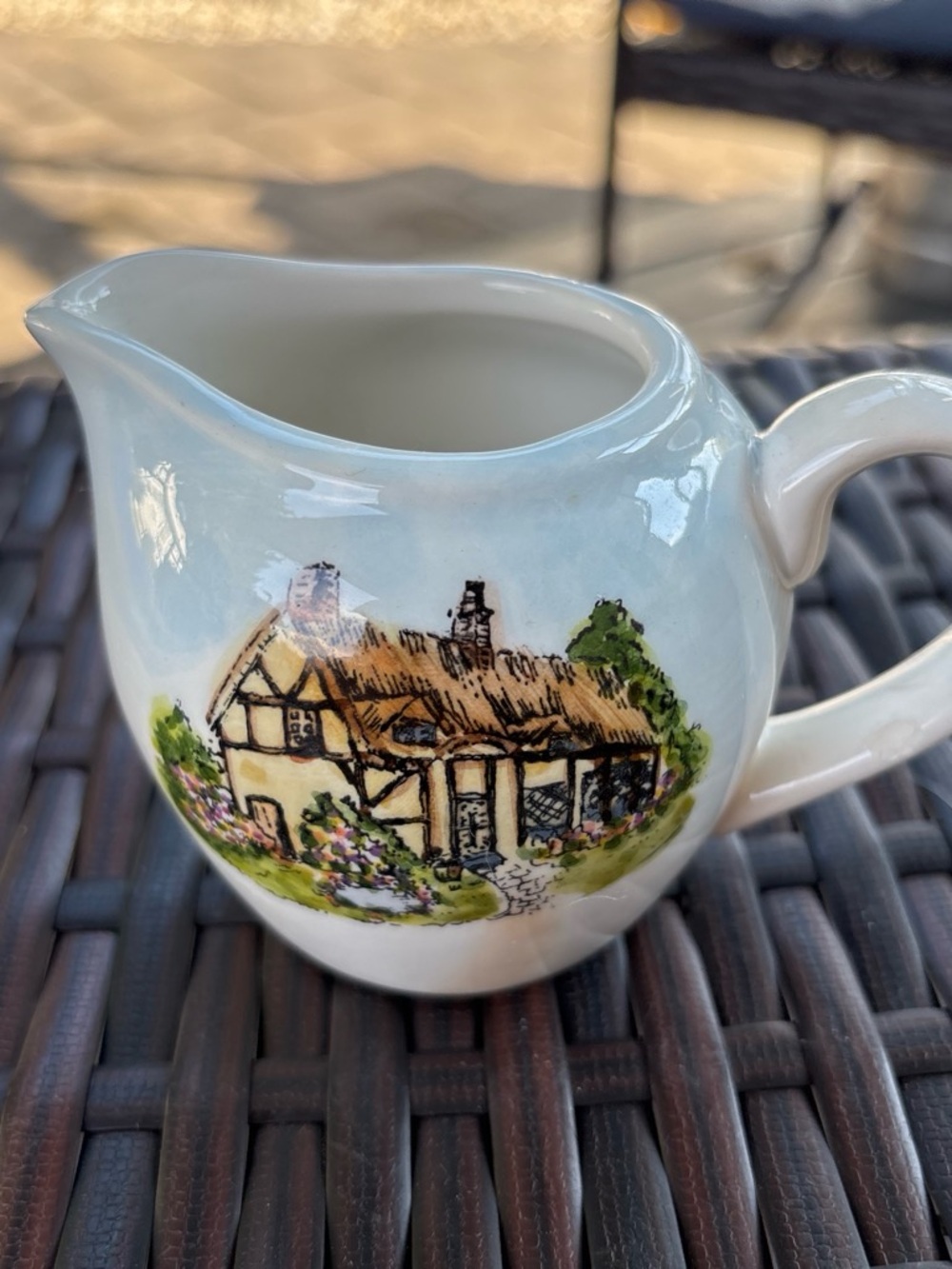 Source Unknown White Ceramic Creamer with Hand-Painted Cottage Illustration